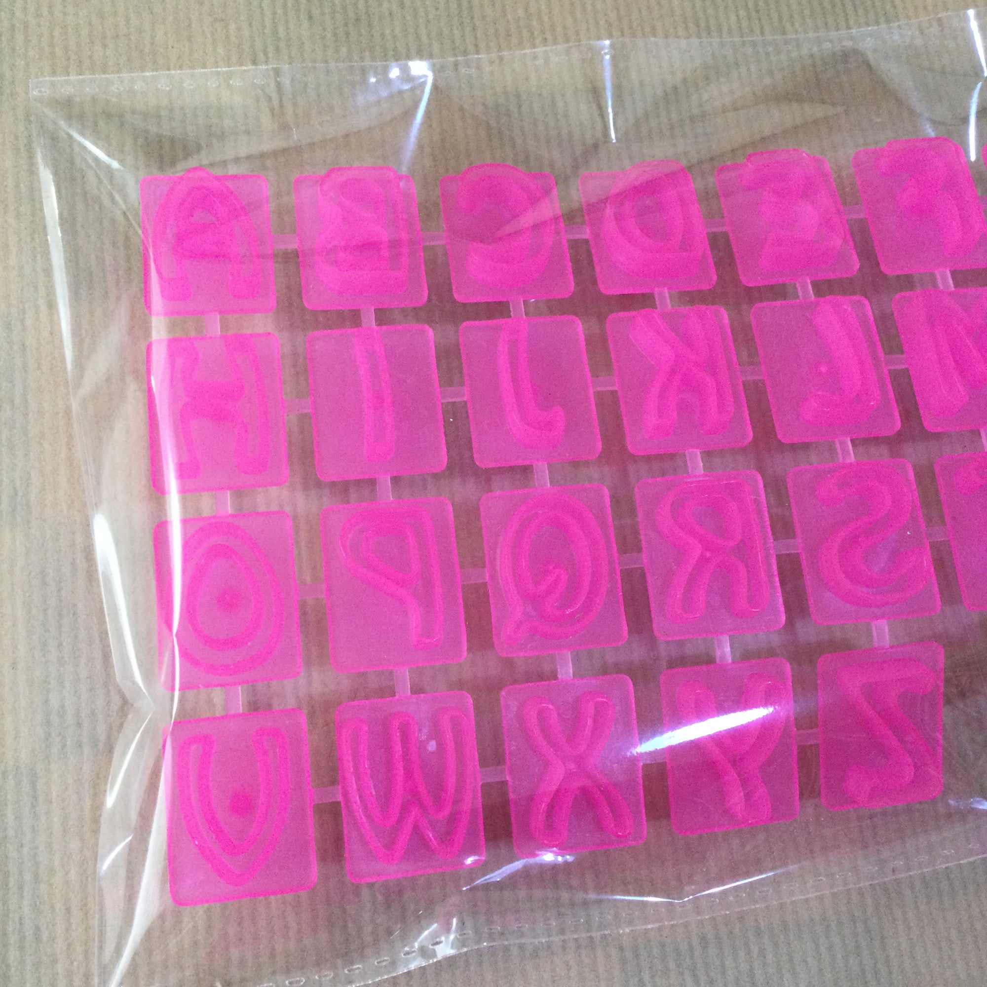 Pink Embossed Alphabet Stamps