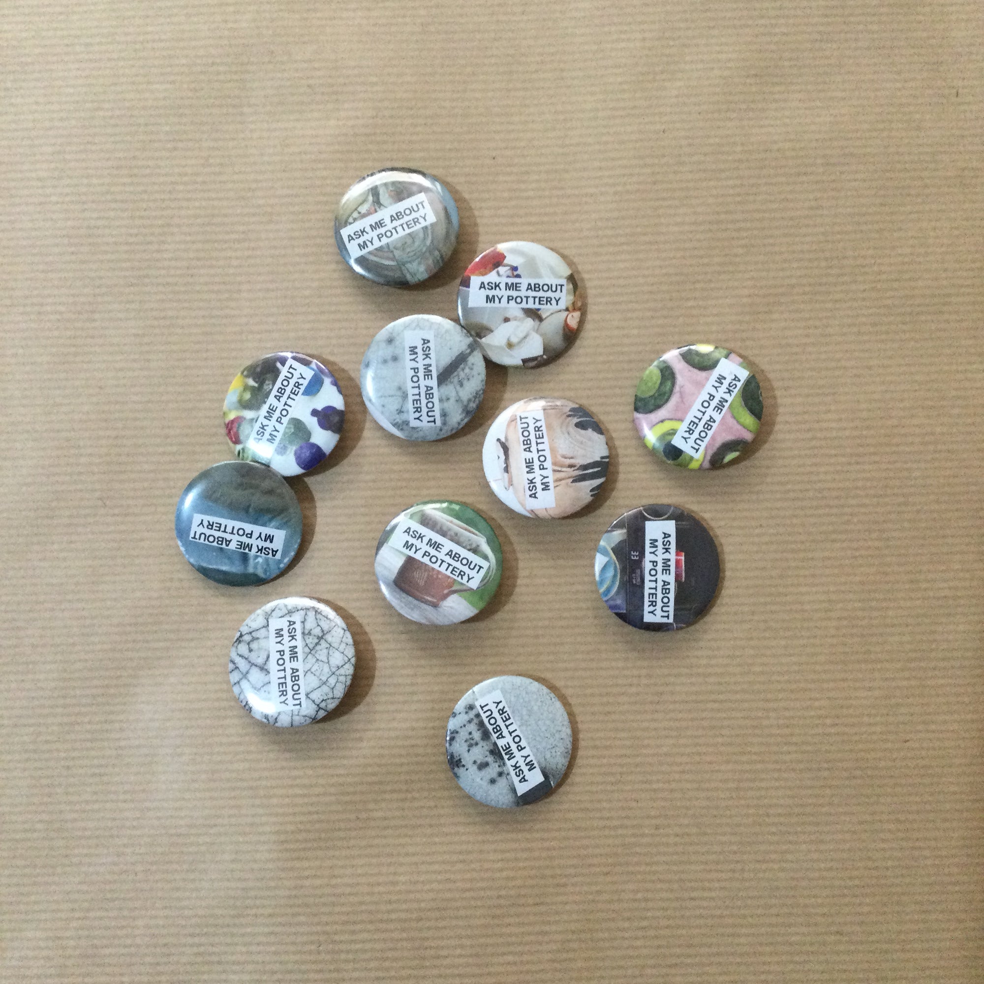 Ask me about my pottery button badge