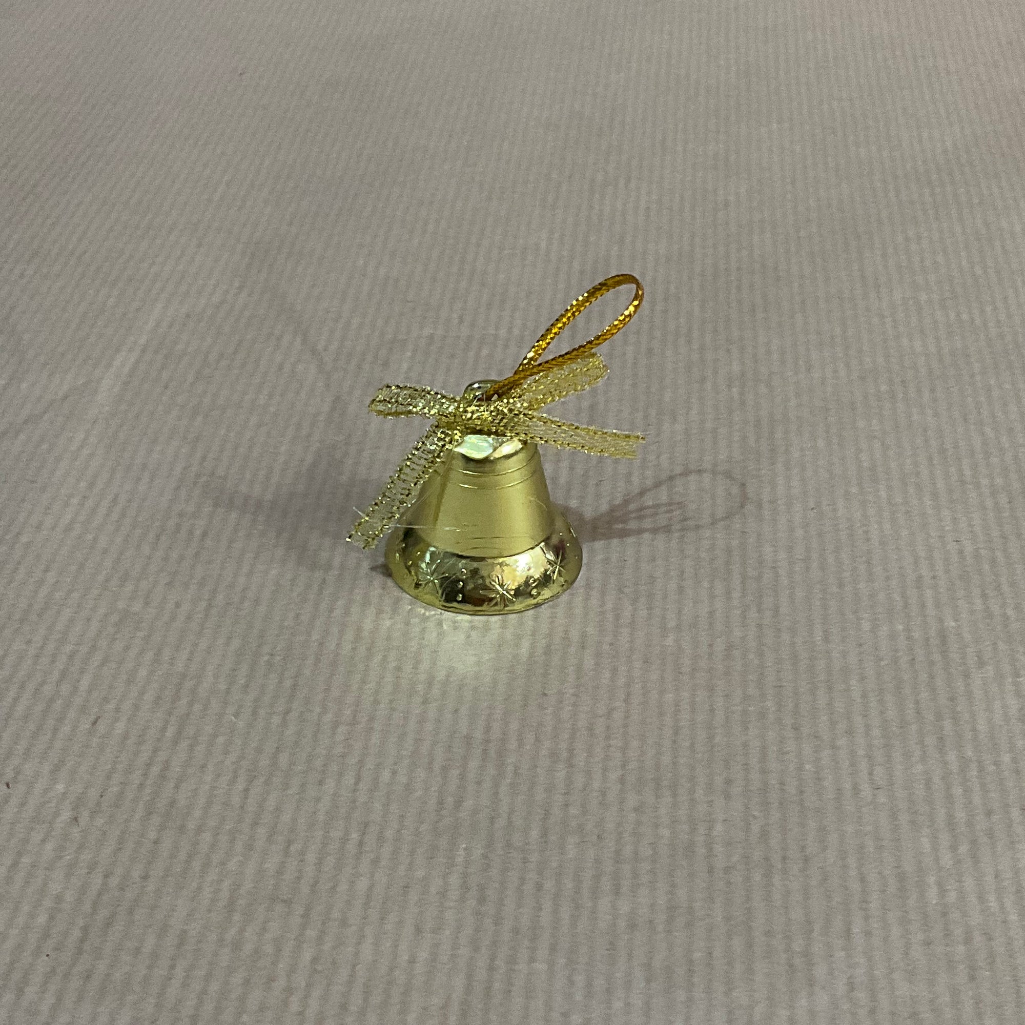 Hanging gold bell with bow
