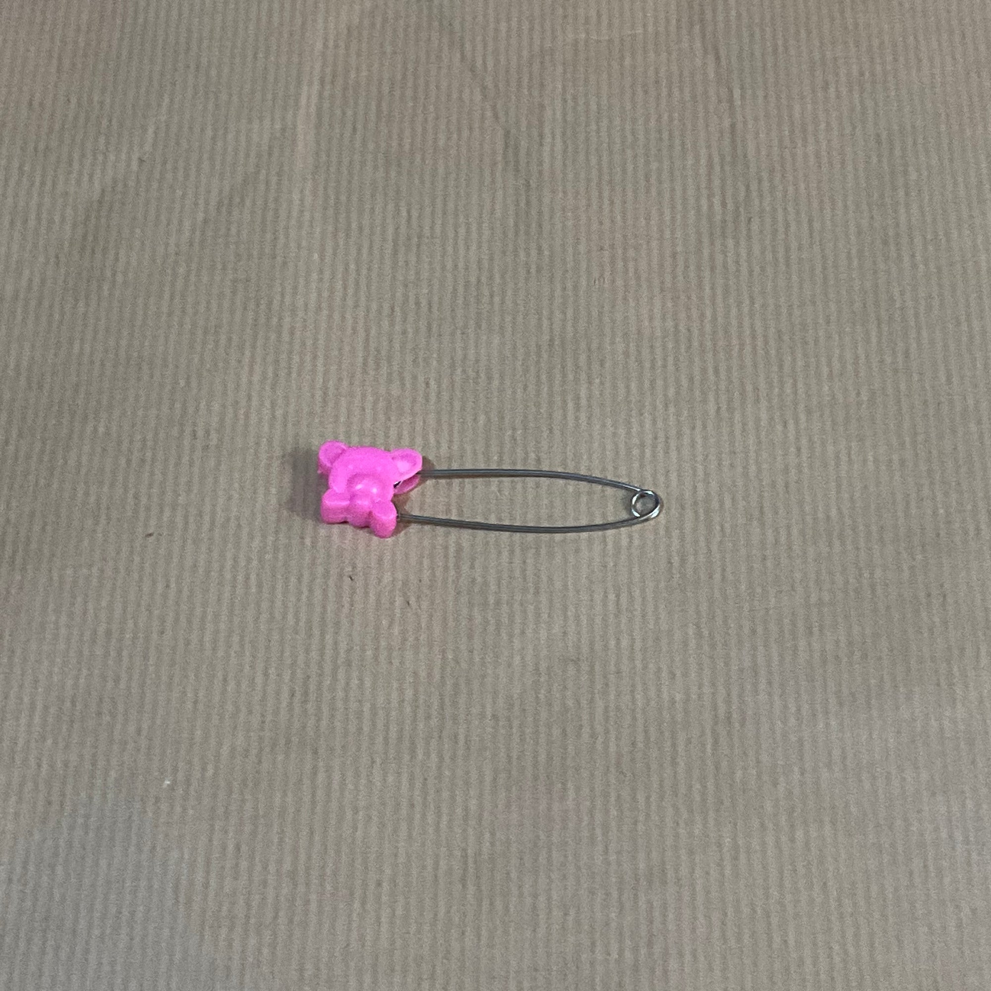 Coloured animal safety pins