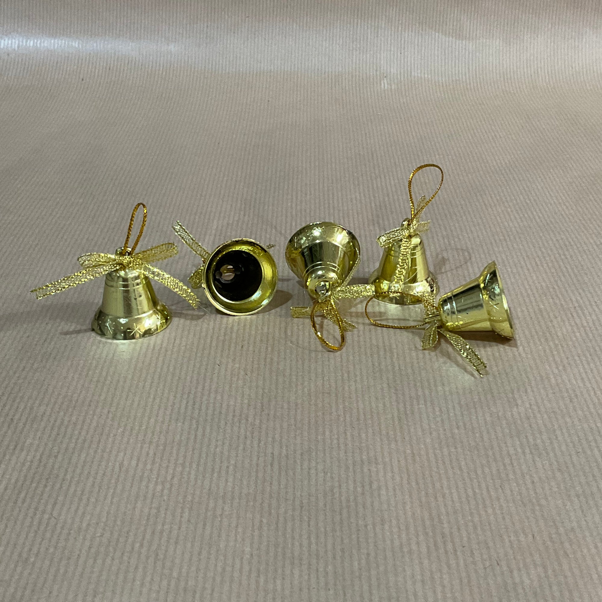 Hanging gold bell with bow
