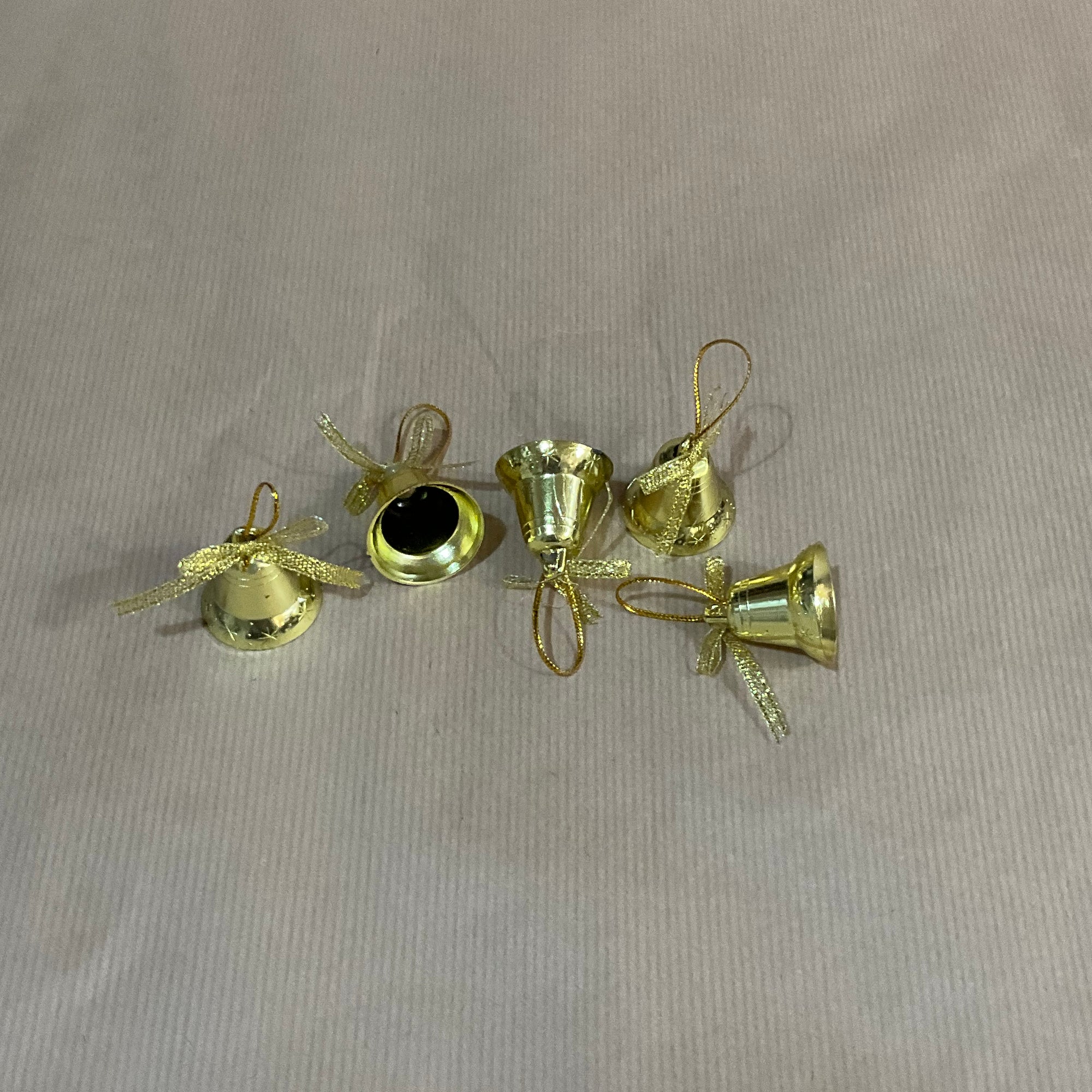 Hanging gold bell with bow