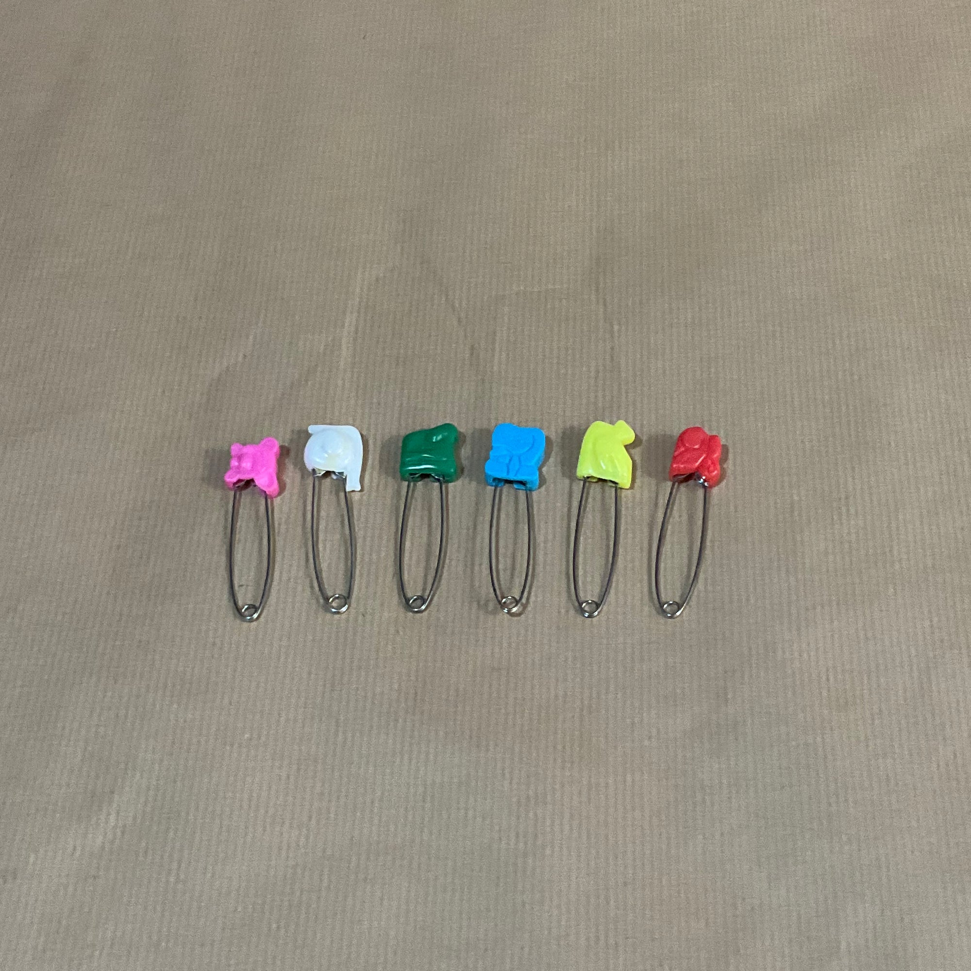 Coloured animal safety pins