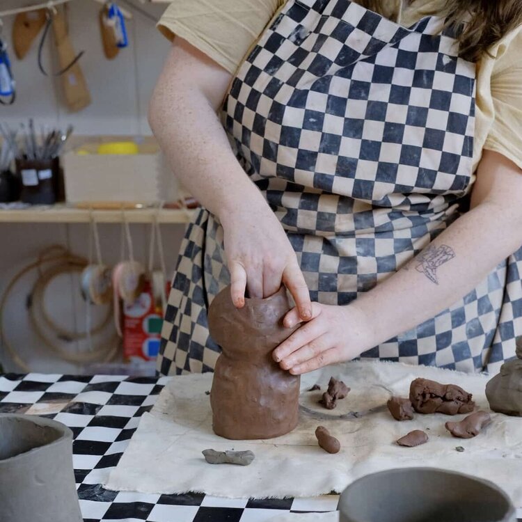 Person hand-shaping a clay pot at ceramics studio Trylla Bristol